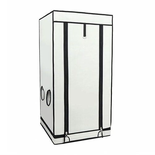 Grotelt HOMEbox Ambient Q60 præsenterer en rektangulær struktur med en grå, stoflignende overflade, der giver et blødt udseende. Den har en let skrånende taglinje, der afsluttes med en mørkere kant. Fronten er præget af et stort, transparent vindue, der indrammes af en subtil, hvid kant. Elementet står på en flad, stabil bund.