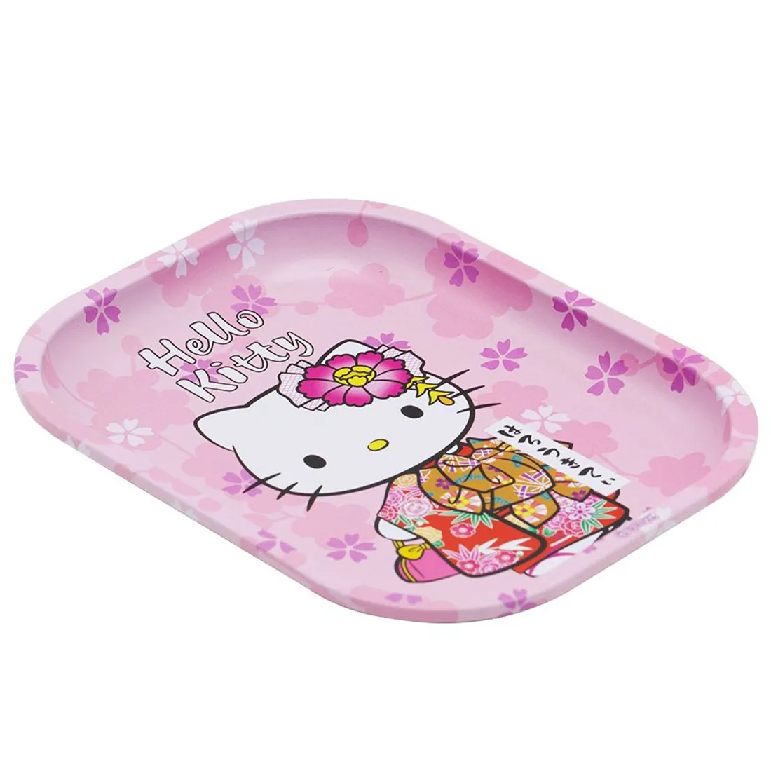 Et rektangulært fad præsenteres med en lyserød baggrund. Overfladen prydes af et gentaget mønster af Hello Kitty, som viser den karakteristiske kat med en rød sløjfe. Kanterne er let buede, og fadet har en glat, skinnende finish. Størrelsen er 140 x 180 mm, hvilket giver en kompakt og praktisk form.