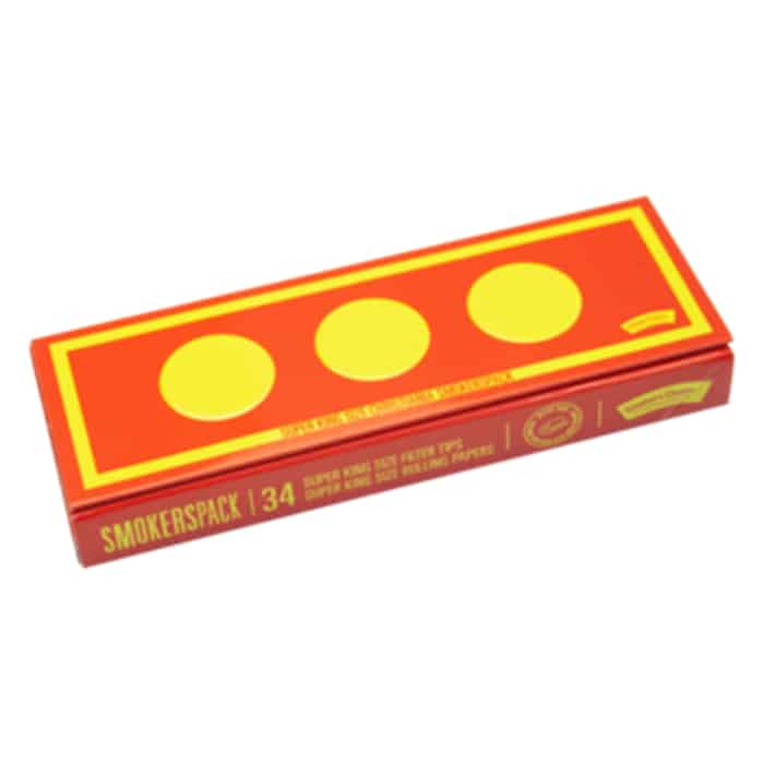 En rektangulær pakke i brune og sorte nuancer pryder forsiden med en grafisk illustration af en røgfyldt scene. Teksten "Smoker's Choice" fremstår i store, hvide bogstaver, mens "Christiania" er skrevet i en mindre, skrå skrifttype. Materialet ser ud til at være papir med en mat finish, og kanterne er skarpe og veldefinerede.