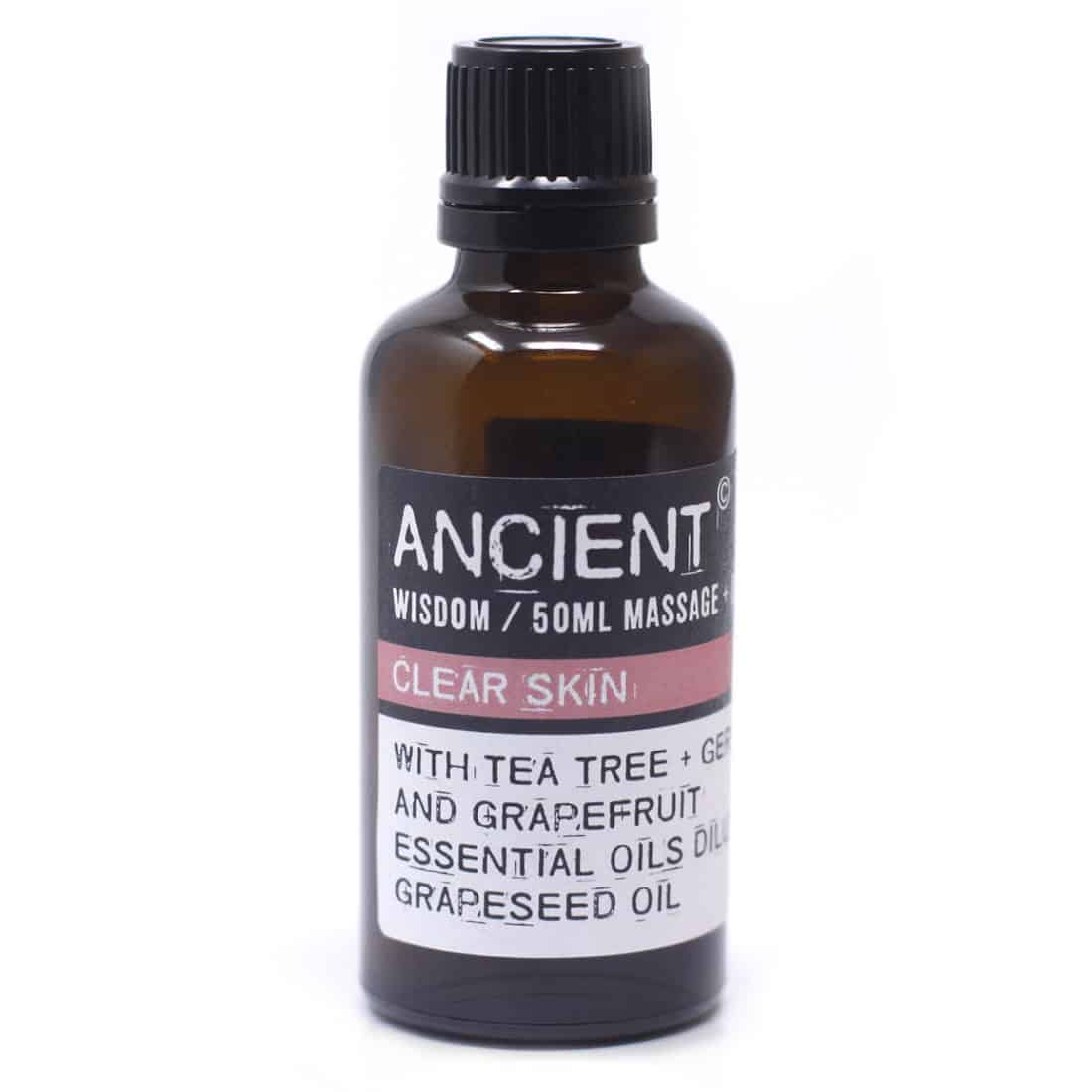 En gennemsigtig flaske med en let buet form indeholder en gylden olie. Flasken har en sort skruelåg med en indbygget pipette, der gør det nemt at dosere indholdet. Etiket med elegant skrifttype pryder flaskens front og angiver produktnavn samt indhold. Baggrunden er neutral, hvilket fremhæver flaskens farver og tekstur.