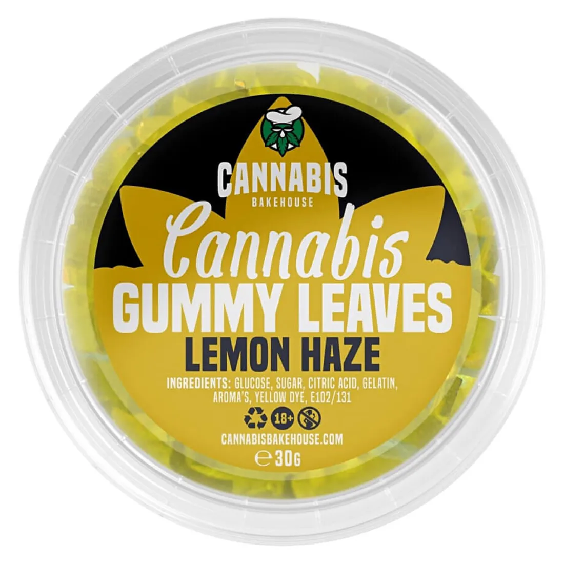 Gummibearbejdet slik har en smuk, klar grøn farve med en glinsende overflade. Formen ligner et blad med fine, detaljerede vener, der giver tekstur og dybde. Slikket er prydet med en let sukkerbelægning, der skaber en let krystalklar effekt. Det har en blød og elastisk konsistens, der indikerer, at det er lavet af naturlige ingredienser.