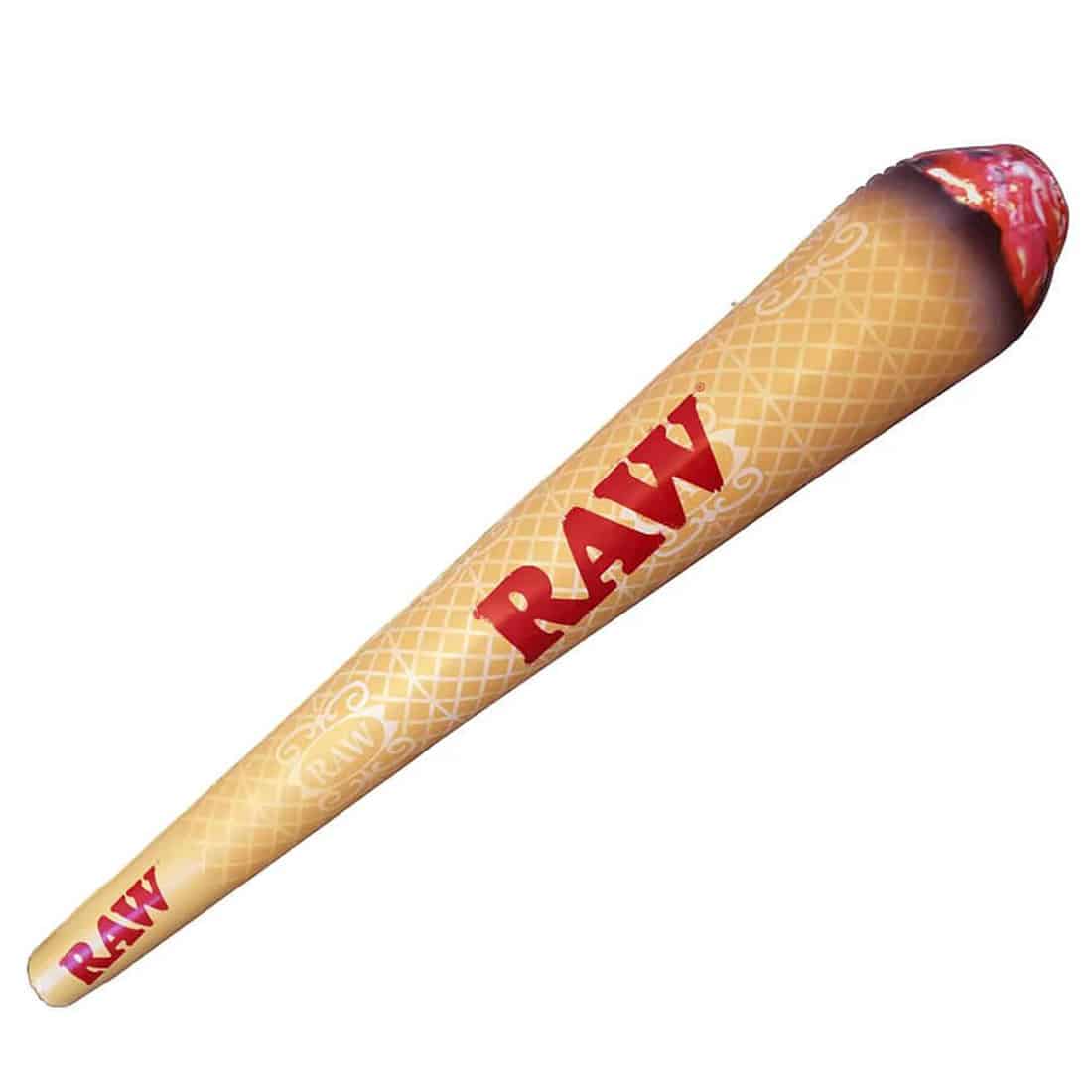 En oppustelig joint i lyse nuancer af grøn, hvid og grå pryder midten af kompositionen. Den har en lang, cylindrisk form med en let buet top. Overfladen fremstår glat og skinnende, med tydelige konturer og en realistisk struktur. Mønstret på jointen efterligner cannabisblade, hvilket tilføjer et detaljeret element til det visuelle indtryk.