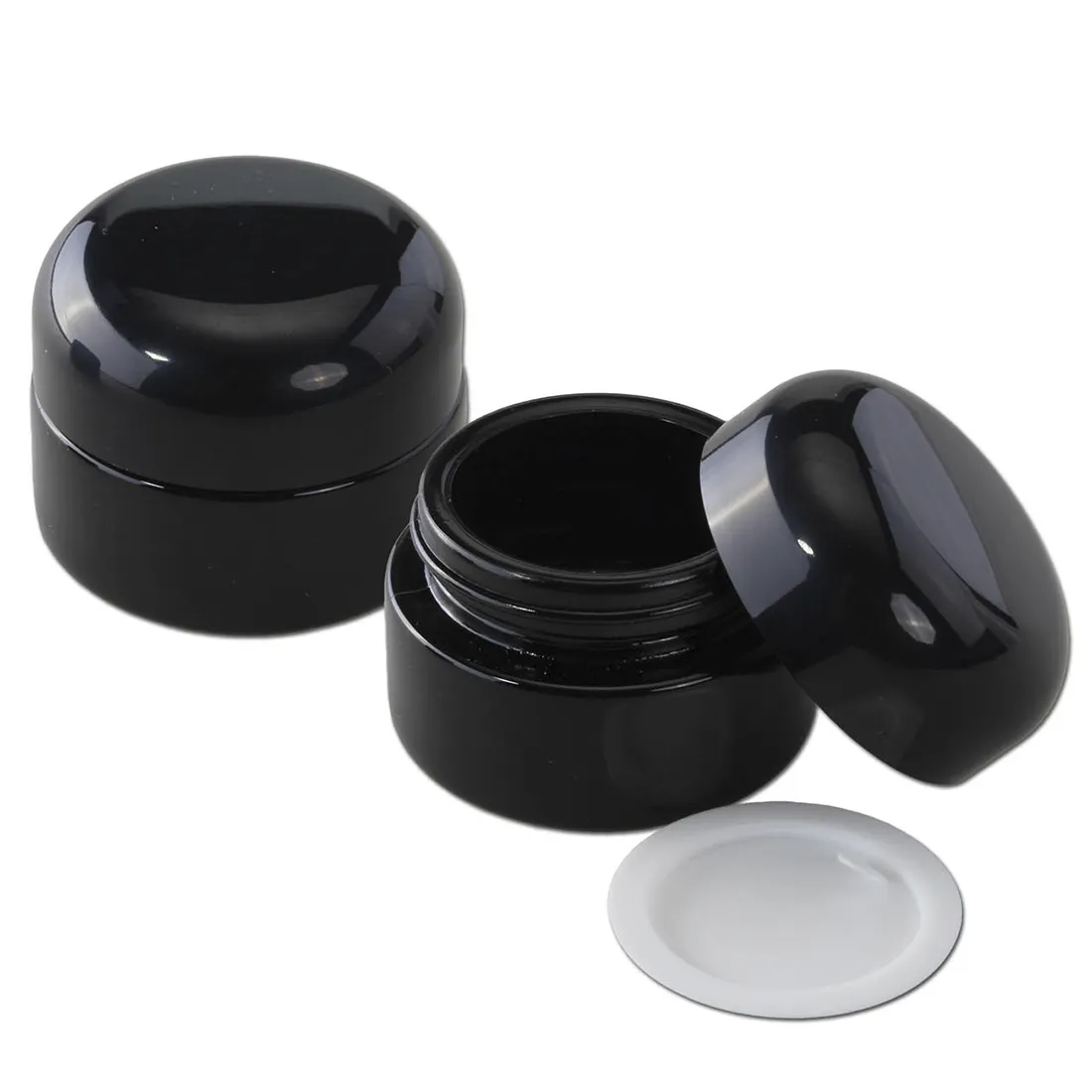 En lilla glasbeholder med en bred hals og en fyldig form. Beholderen har en glat overflade, der reflekterer lyset, hvilket fremhæver dens dybe farve. Den er 15 ml stor og har en ensartet tykkelse. Toppen er åben, hvilket gør det nemt at tilgå indholdet, og kanten er let afrundet for et blødt udseende.