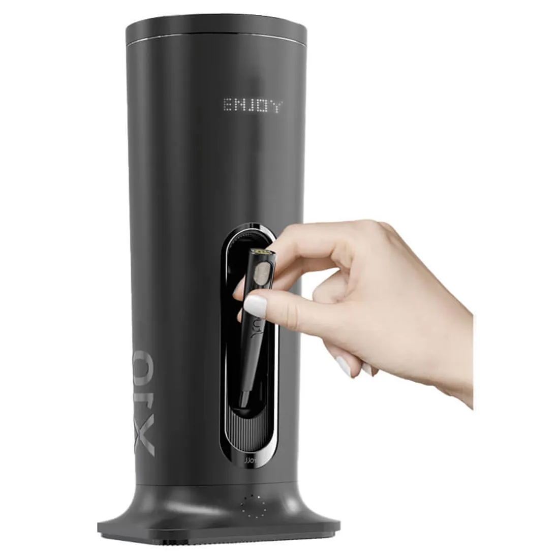 Det multifunktionelle apparat har en glat, sort plastoverflade med en ergonomisk form. På toppen findes en afrundet beholder med gennemsigtig plastlåg. En række knapper i metal med forskellige symboler er placeret på fronten, mens en digital skærm viser information. Bunden er udstyret med skridsikre gummifødder for stabilitet.