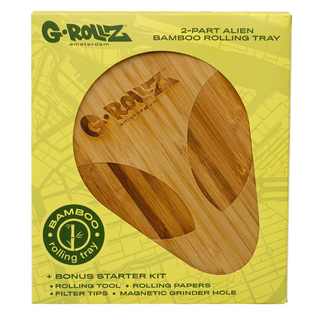 Bamboofadet præsenterer en naturlig, lysbrun overflade med fine, strømmende åretegninger, der fremhæver materialets struktur. Det har en rektangulær form med afrundede kanter. På overfladen er der indgraveret et stiliseret alien-design, der tilføjer et legende element. Fadet hviler på en glat, ensartet baggrund, der fremhæver dets finish og detaljer.