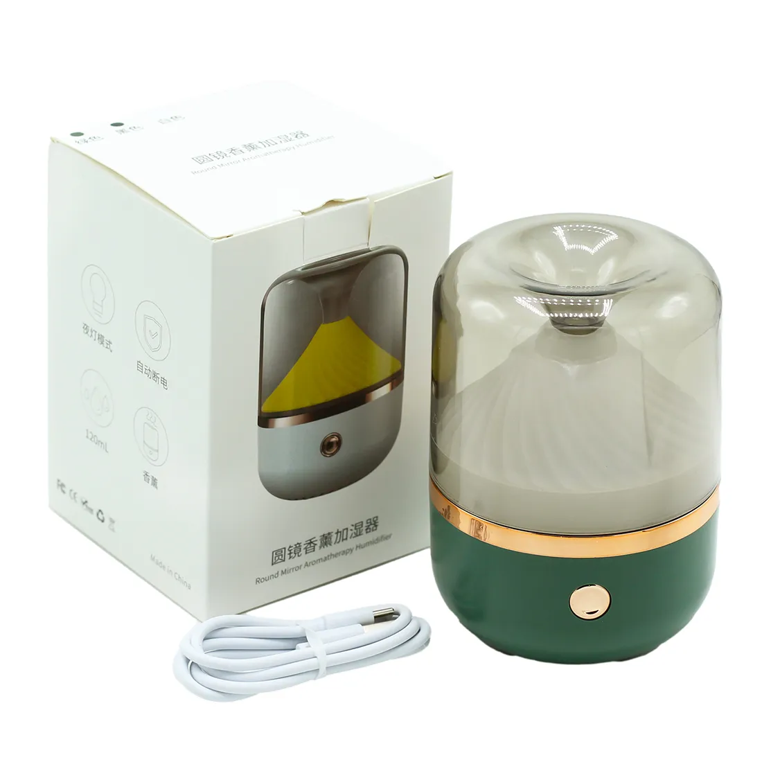 En aroma diffuser præsenterer en slank, cylindrisk form i en mat grøn farve, der glider elegant ind i rumindretningen. Øverste del er forsynet med en gyldenbronzefinish, der tilføjer et subtilt kontrast. Diffuserens overflade har en glat tekstur, og der er en diskret knap placeret nær bunden. En lille åbning øverst antyder dampudslip.