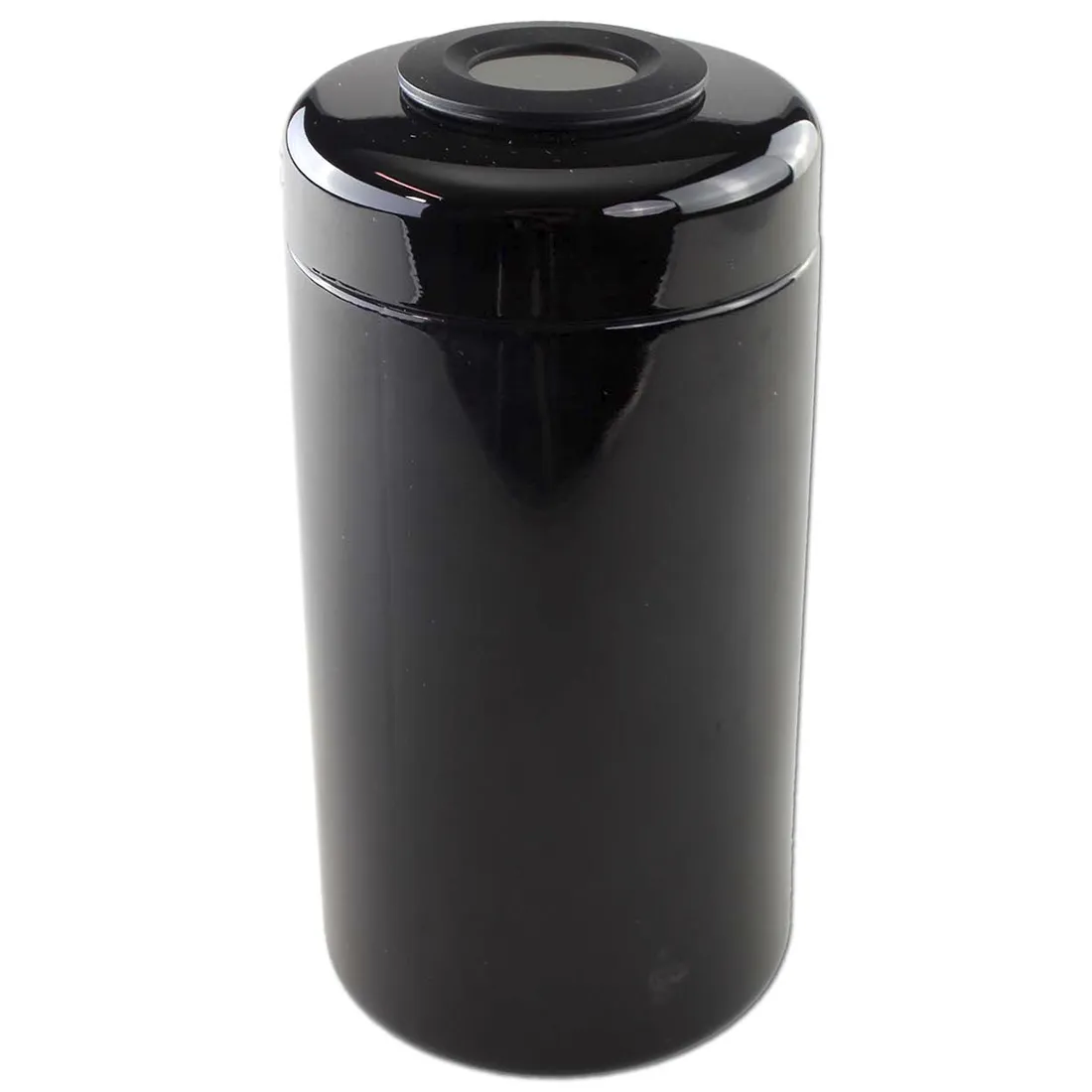 En violet glasbeholder med en bred åbning præger synet. Beholderens overflade er glat og reflekterer lys, hvilket fremhæver den dybe farve. Indeni ses et hygrometer i metallisk finish med en cirkulær skala, der viser fugtighedsniveauer. Knapperne er små og sorte, placeret langs kanten, og der er tydelige symboler for forskellige fugtighedsniveauer.