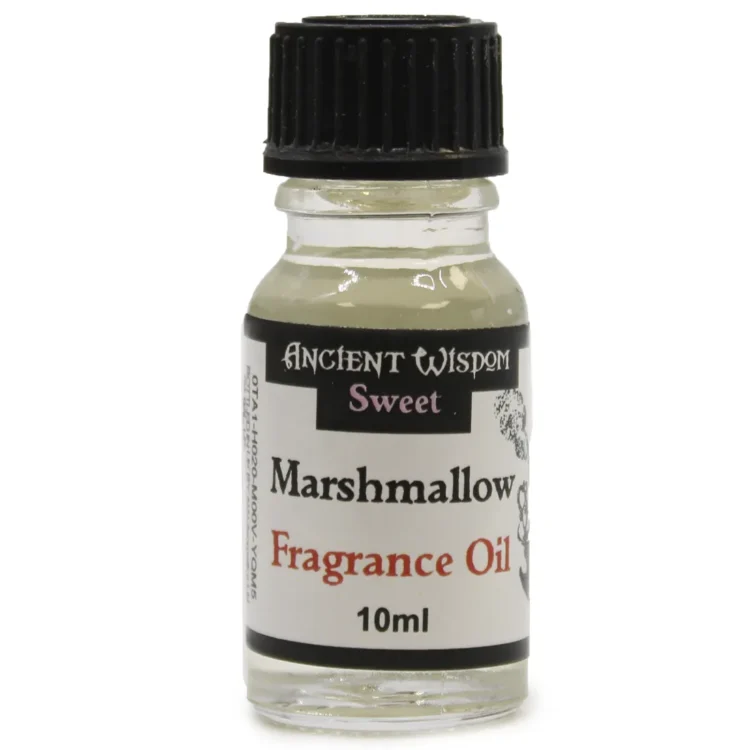 En lille, klar glasflaske med en sort skruelåg, fyldt med gylden væske. Flaskens etiket er hvid med sort skrift, der angiver produktnavnet og volumen. Flasken har en cylindrisk form og står på en neutral overflade. Mærkets design omfatter en enkel, elegant typografi, som fremhæver duftoliens indhold af skumfidus.