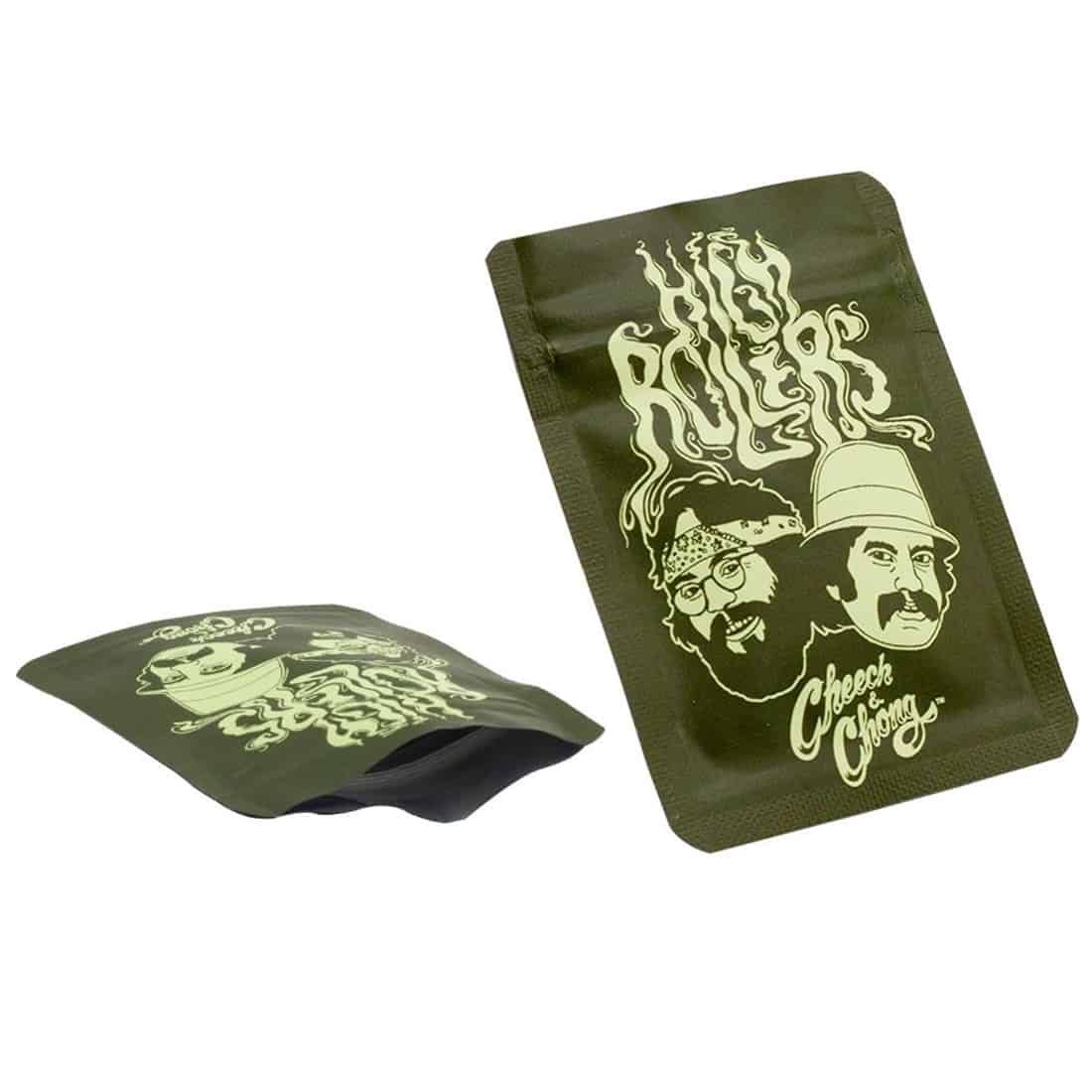 En rullende tobaksartikel præsenterer sig med en mat, sort overflade og detaljeret grafik, der viser farverige illustrationer af to karakterer fra en klassisk film. Rullen har en kompakt form og måler 65 x 85 mm. Det grafiske design inkluderer levende farver og en kombination af tekst og billeder, der skaber en iøjnefaldende visuel effekt.