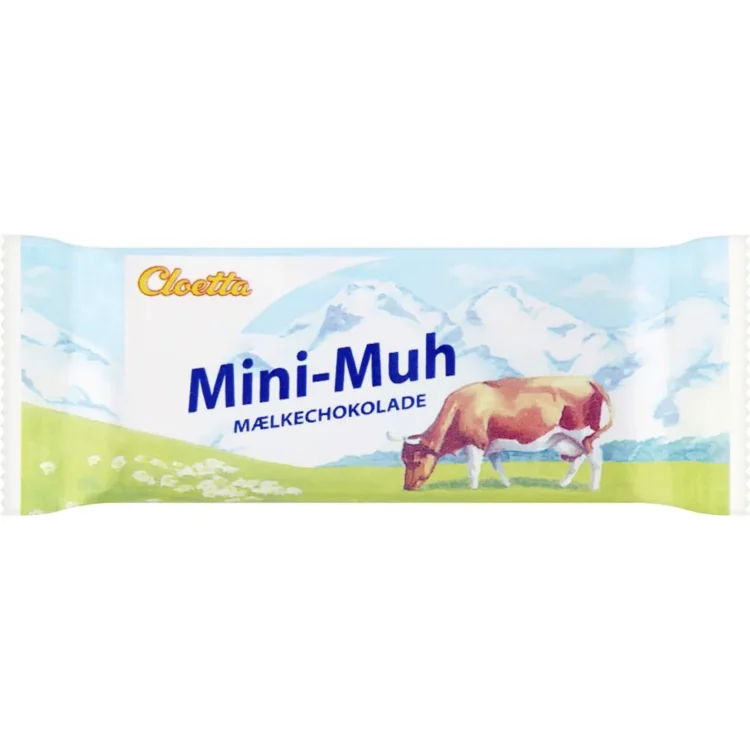 En lille, rund pakke med en glat, mat overflade præsenterer sig i en lys beige farve. Foran står teksten "Mini Muh" i tydelig, sort skrift, mens vægten "15 gram" er angivet under. Pakken har ingen synlige lukninger eller knapper, og kanterne er skarpe og veldefinerede. Det overordnede design signalerer enkelhed og funktionalitet.