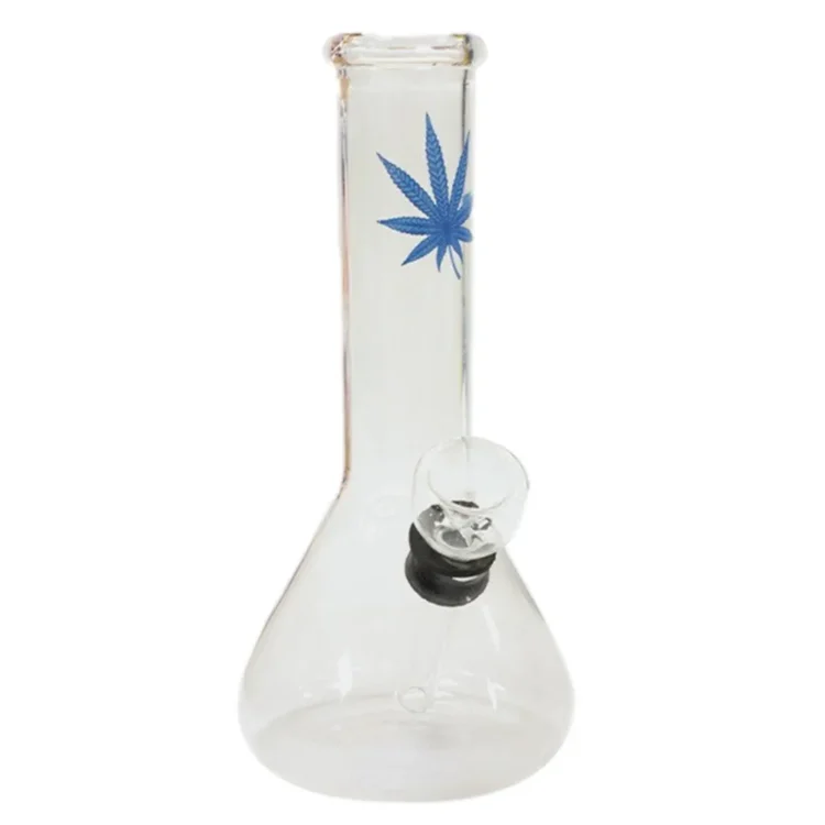 En lille, blød figur i lyseblå farve med rund hovedform og korte ben. Overfladen har en glat tekstur, mens ansigtstræk som store øjne og en lille mund tilføjer et venligt udtryk. Figuren har en let bølget kant, der skaber en legende detalje. Den er 15 cm høj og kan stå stabilt på en flad overflade.