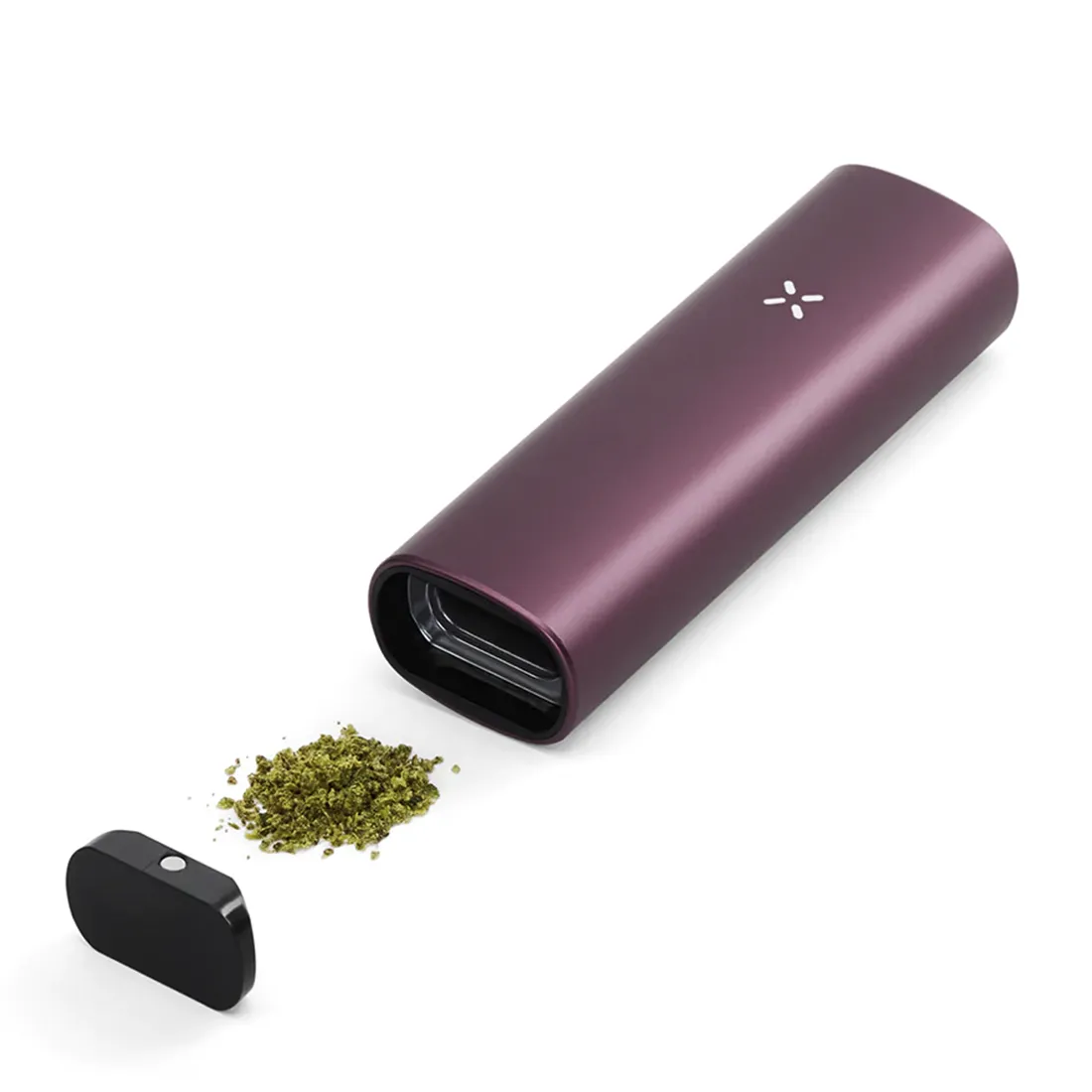 En kompakt vaporizer præsenterer sig i en dyb lilla nuance, der minder om brombær. Den har en glat, mat overflade og er formet med bløde kurver, hvilket giver et ergonomisk greb. På toppen findes en diskret, rund knap med en lys indikator, mens den nederste del har en fin, tekstureret detalje, der tilføjer visuel interesse.