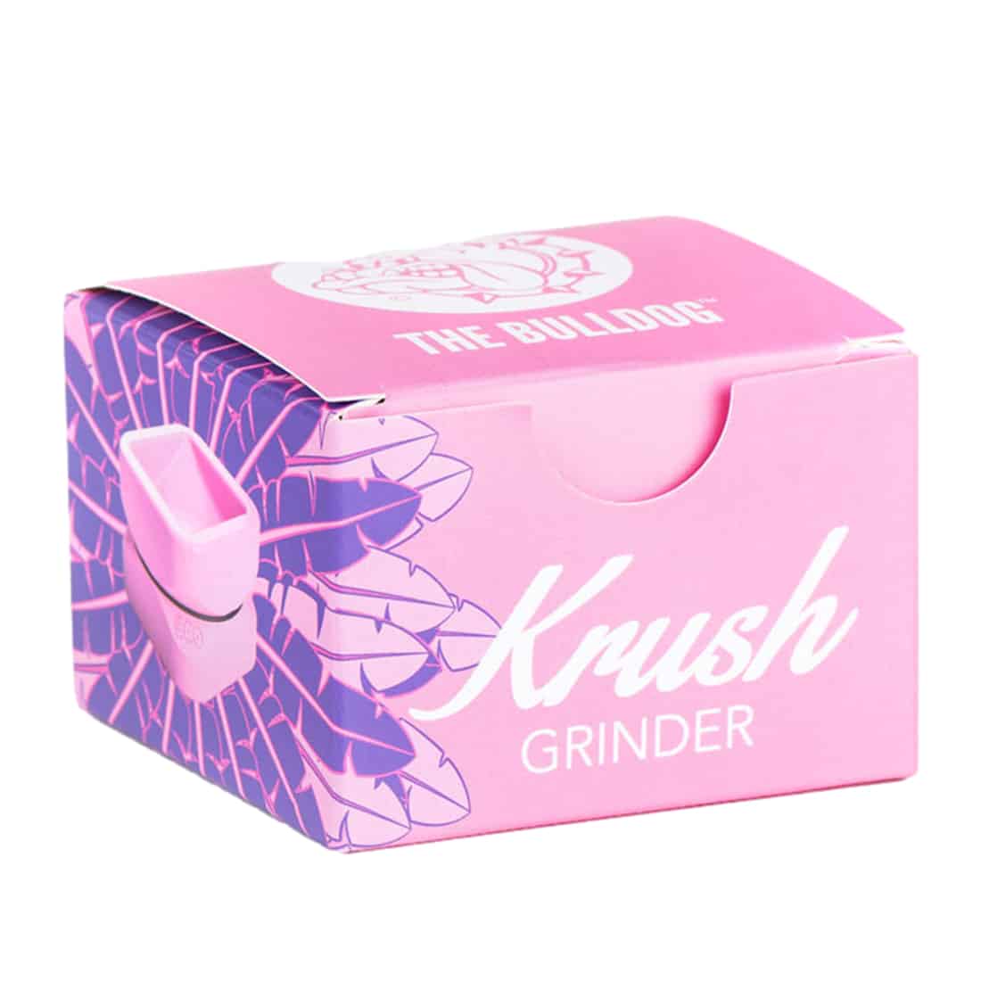 Krush i en blød pink nuance præsenterer en rund form med en glat overflade. Materialet fremstår som silikone, hvilket giver en blød og fleksibel tekstur. Produktet har en diskret logo-tryk i hvid, placeret centralt. Kanten er let afrundet, og den samlede æstetik udstråler en moderne og minimalistisk stil.